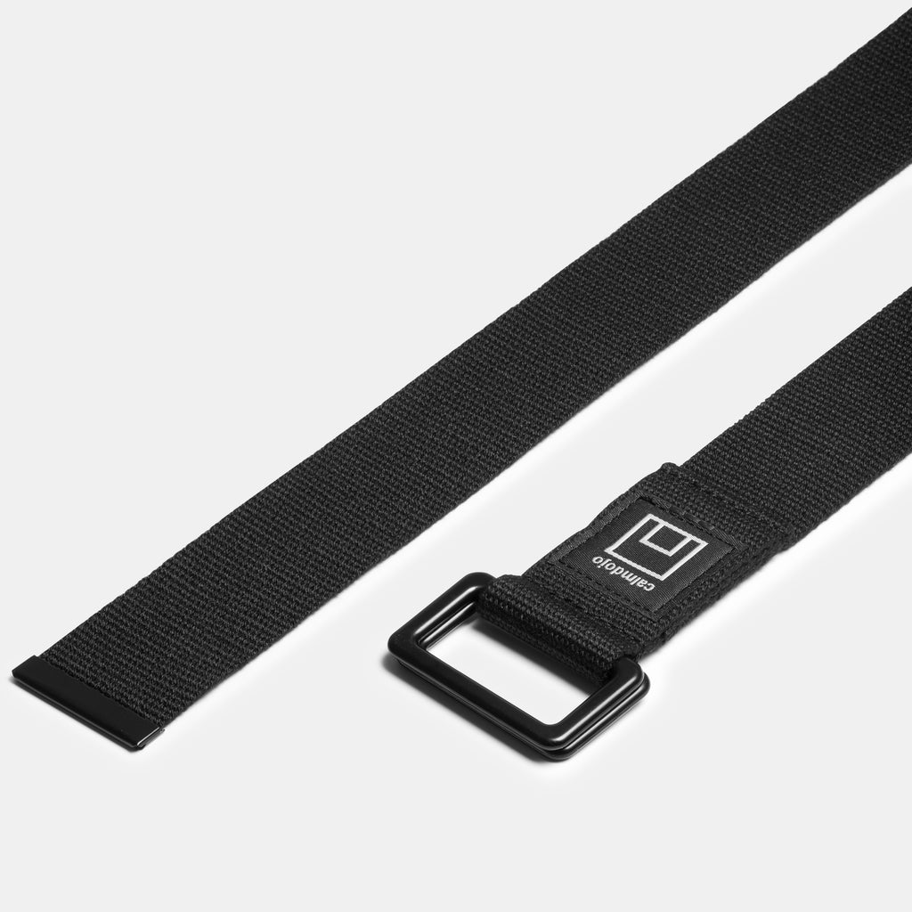 black metal D-rings of yoga strap and metal end visible.